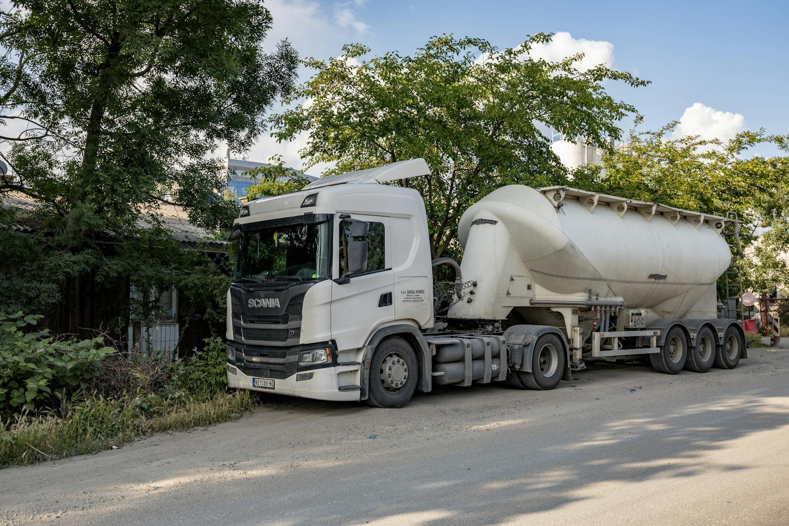Tanker Truck Parked on Side of Road