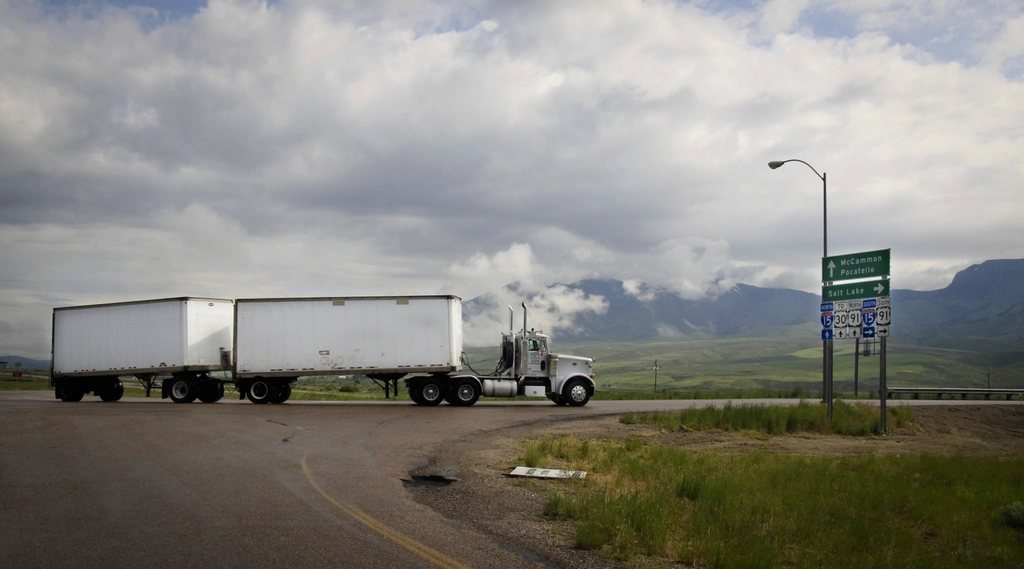 Dry van trailers parked along an interstate route